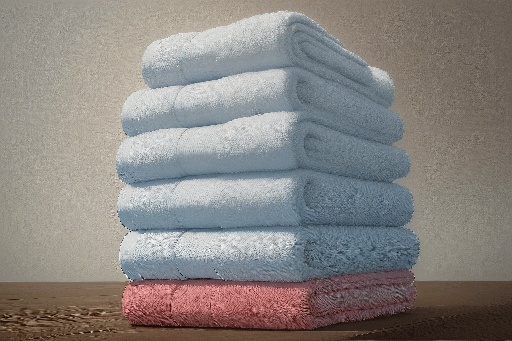 a close up of a stack of folded towels on a table