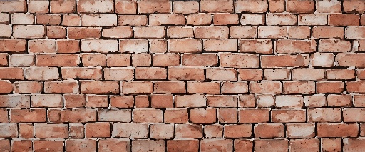 a brick wall with a red and white design