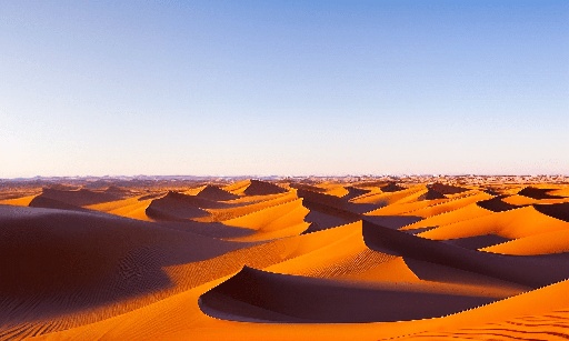 desert with sand dunes and blue sky in the background