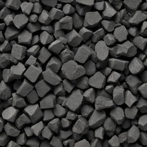 a close up of a pile of black rocks with a white background